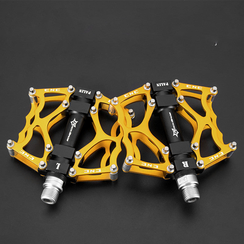 Pair of yellow and black Flat Aluminium Bicycle Pedals on a dark background
