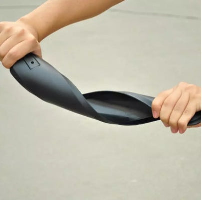 Person folding a black mountain bike mudguard against a neutral background