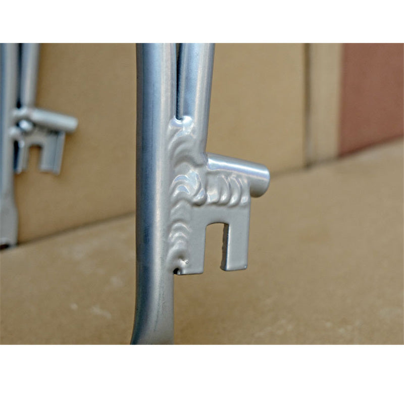 Attachment slots on a silver metal bicyce rack