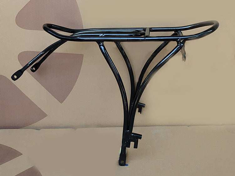 Black metal rear bicycle rack on a beige background