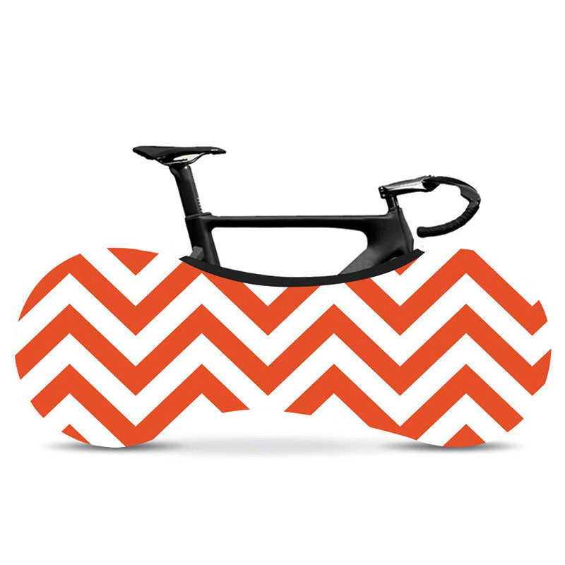 Geometrically-Patterned Bicycle Dust Cover with orange and white chevron pattern covering a black bicycle on a white background