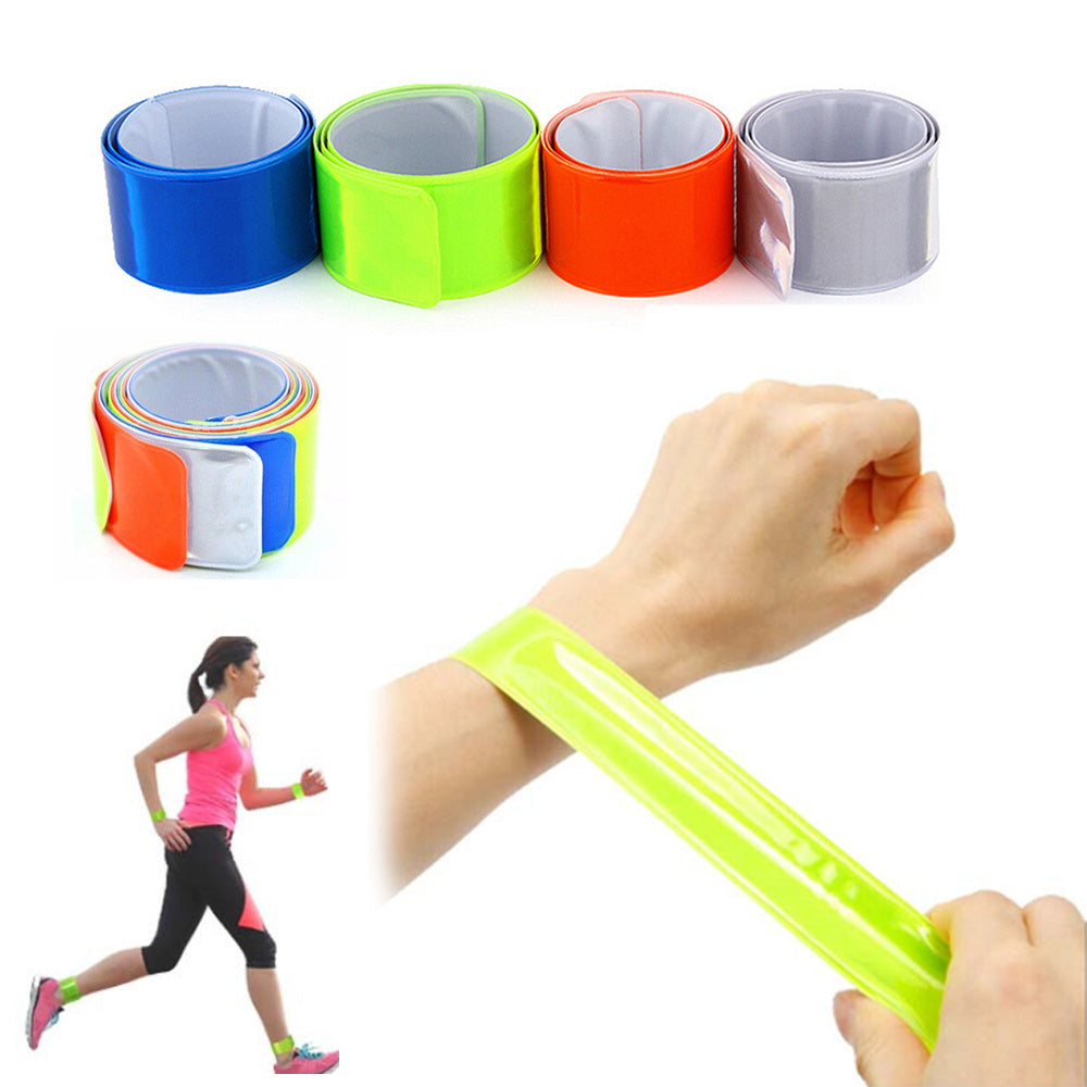 Hi-viz bicycle leg/arm bands with a person using one on a white background
