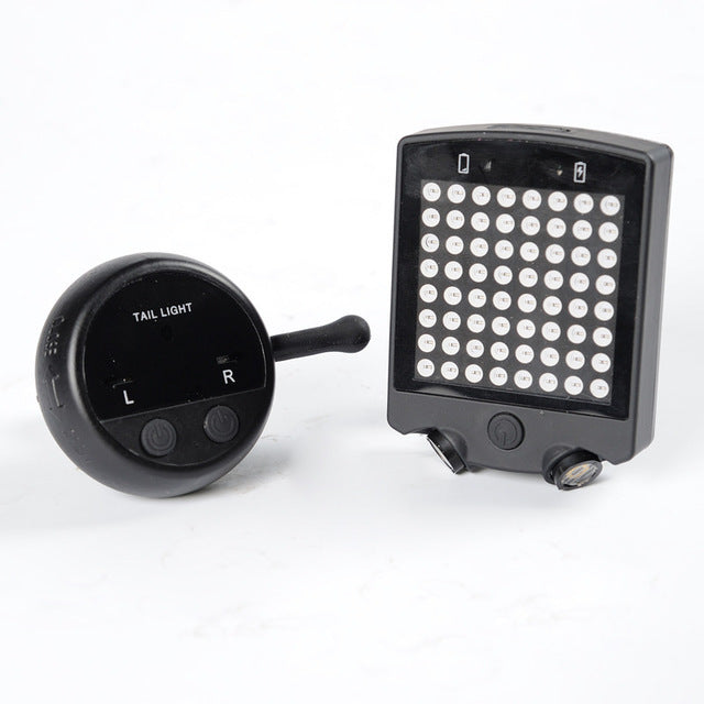 LED Bicycle Indicator Light with remote control unit on a white background.