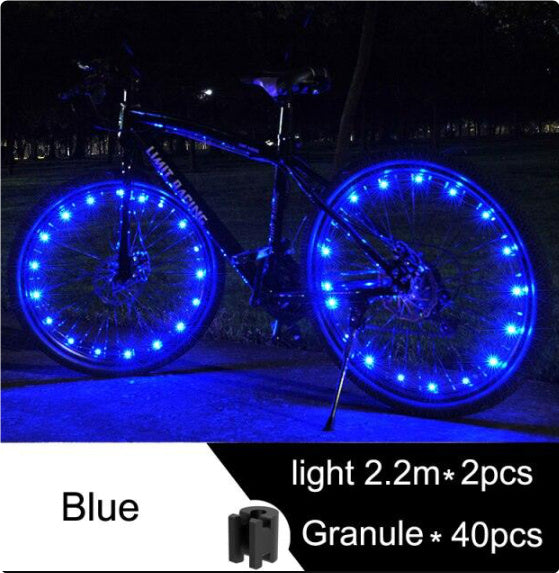 Bicycle with blue LED lights on wheels at night