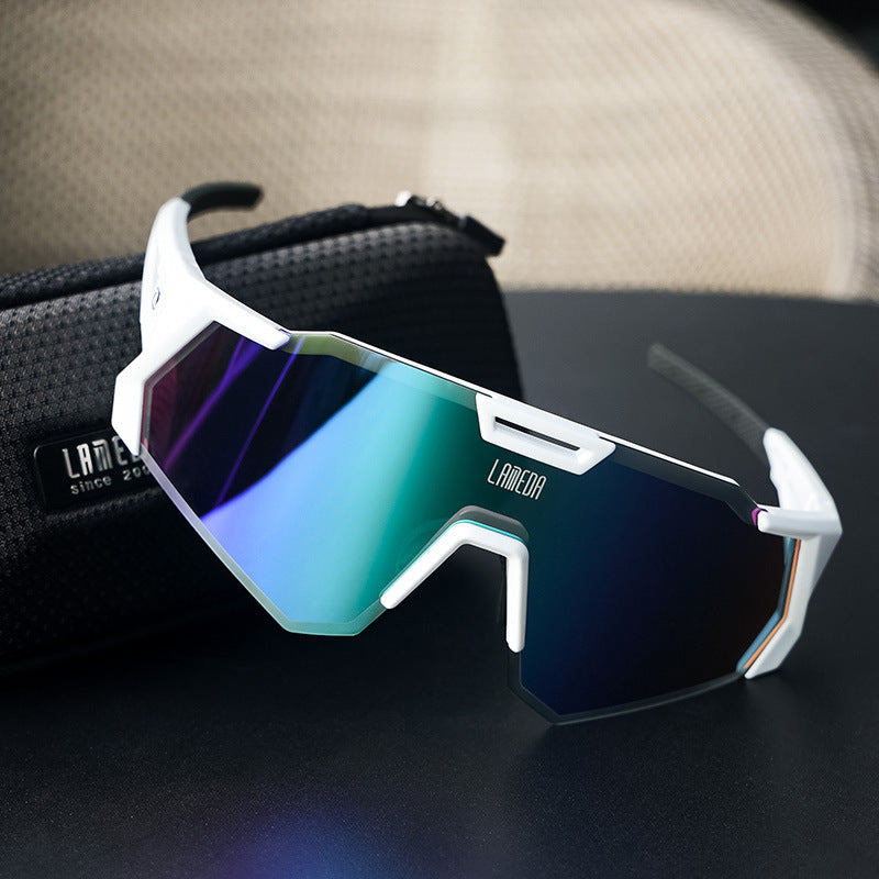 Cycling sunglasses with reflective lenses on a dark surface, featuring the brand 'LAMEDA'.
