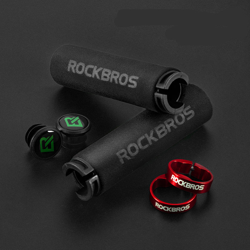 Black MTB handlebar grips with bar plugs, red lock rings and 'ROCKBROS' branding on a dark background