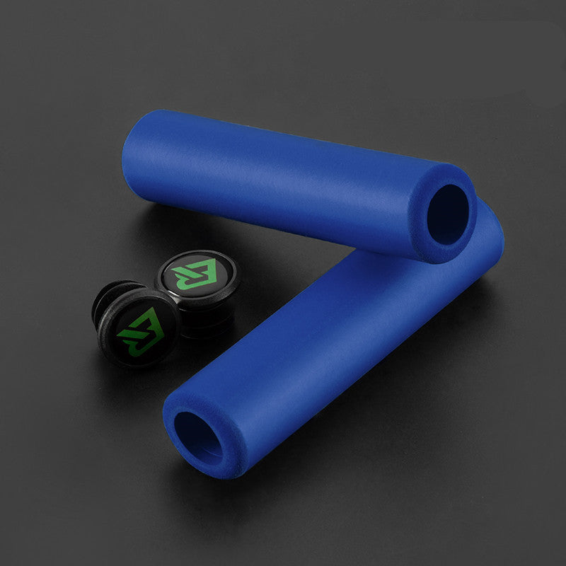 Blue MTB handlebar grips with black end caps featuring a green logo on a dark background