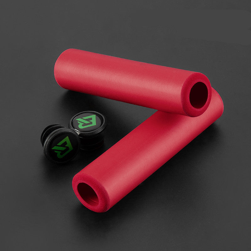 Red silicone handlebar grips with black end plugs featuring a green logo on a dark background
