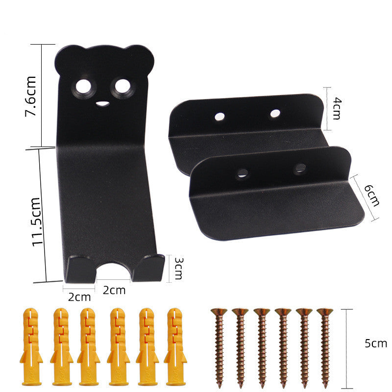 Set of black metal bicycle storage brackets with corresponding screws and rawl plugs on a white background