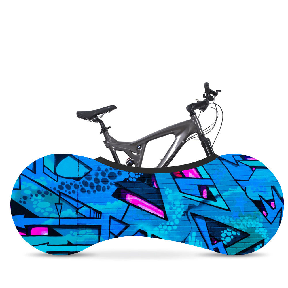 Bicycle on a colorful abstract-patterned bike cover against a white background