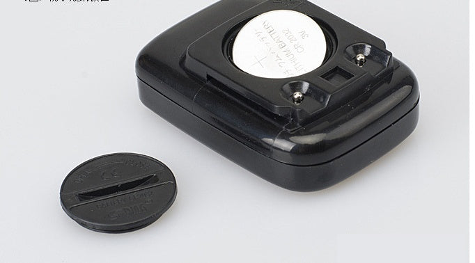 Black Multifunctional Bicycle Computer with a circular battery on a white background