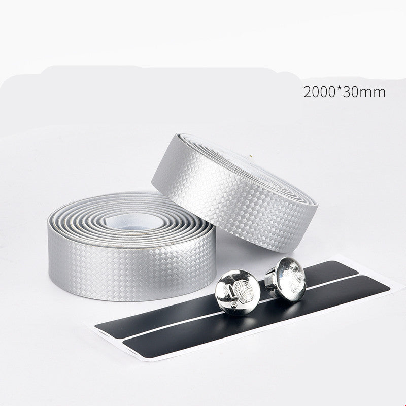 Two rolls of silver handlebar tape with a black strip on a white background