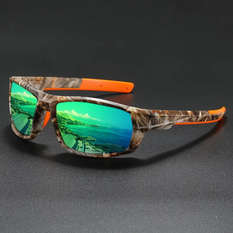 Polarized cycling sunglasses with camouflage frame and orange accents on a dark background