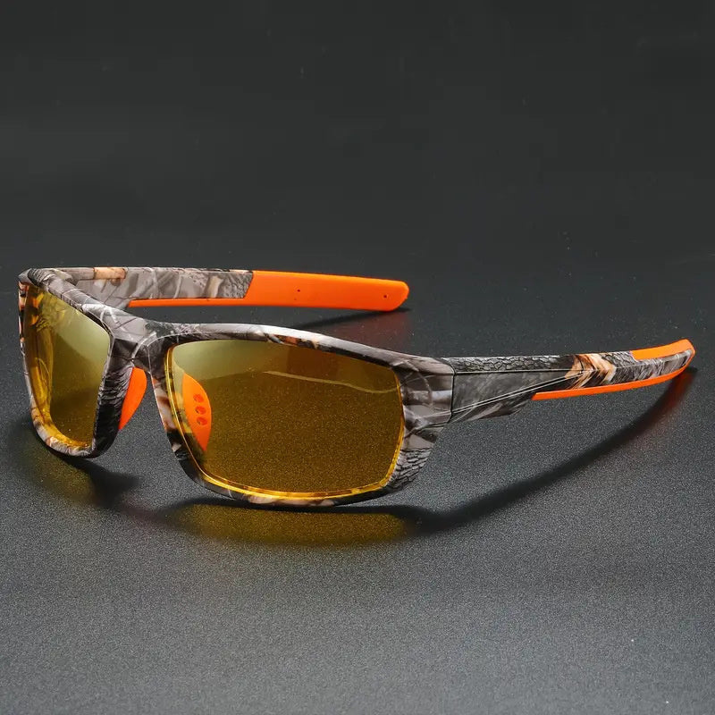 Polrized cycling sunglasses with camouflage frame and orange accents on a dark background