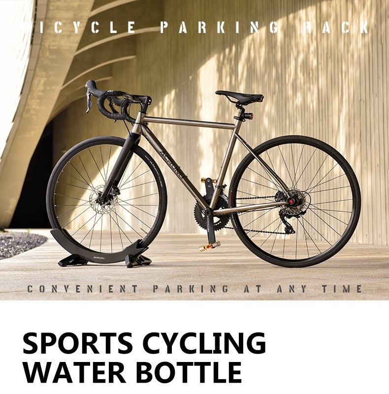 Bicycle supported in a black wheel stand 