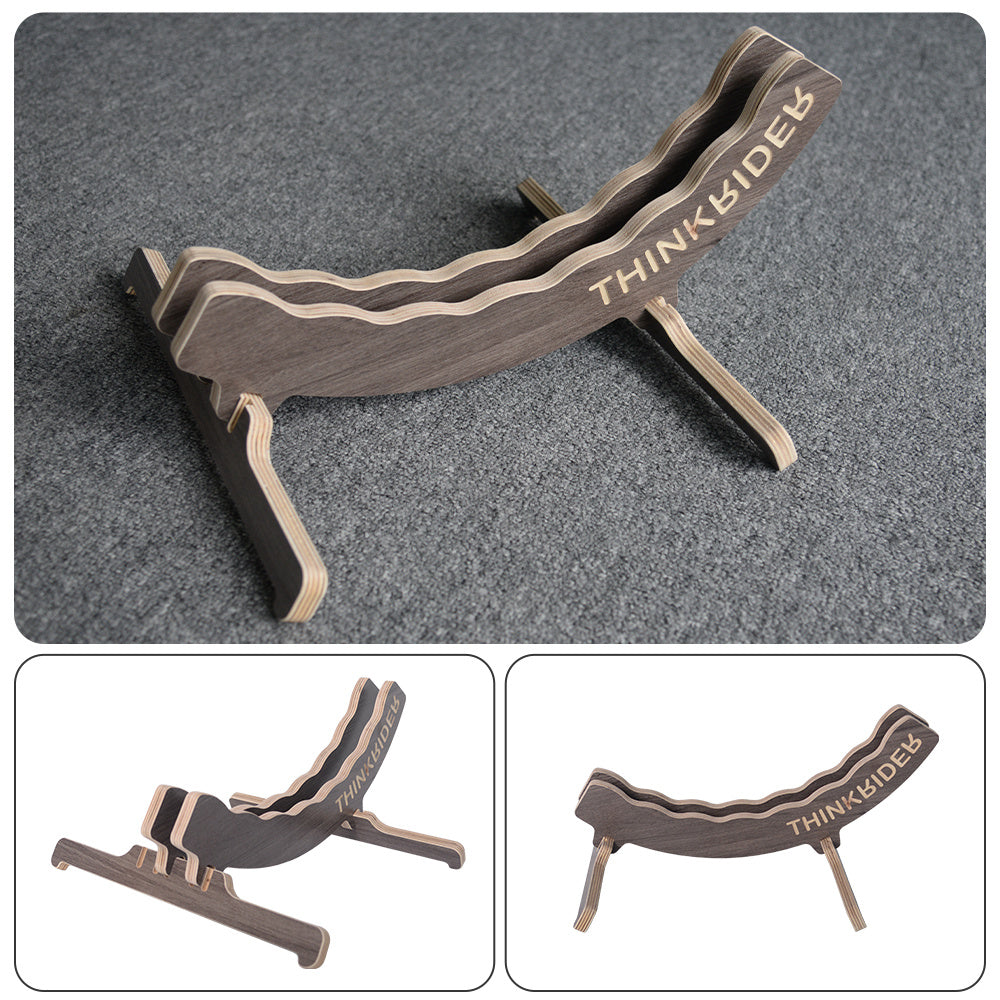 Wooden bicycle wheel stand with 'THINKRIDER' branding on a gray background