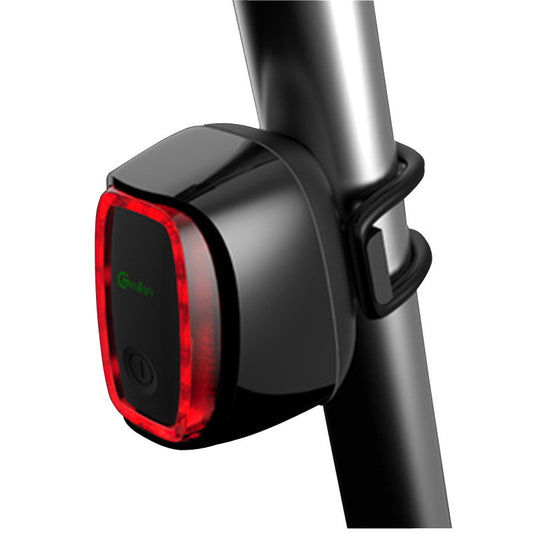 Bicycle tail light attached to a bike seat post on a white background