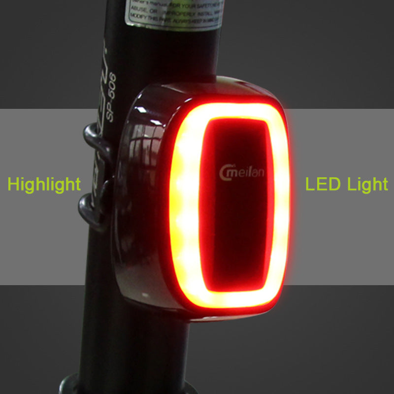 Bicycle LED tail light with on a dark background