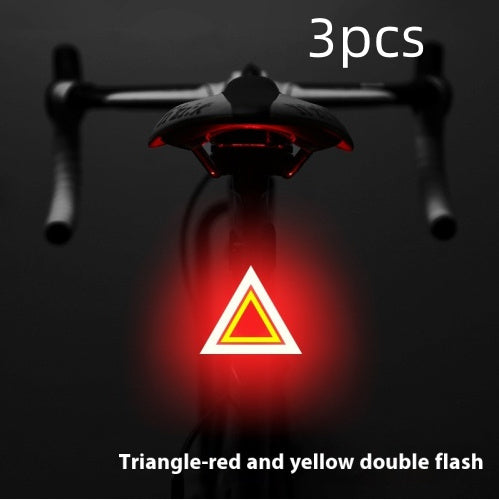 Rechargeable USB Bicycle Rear Light with red and yellow triangle warning symbol on a dark background