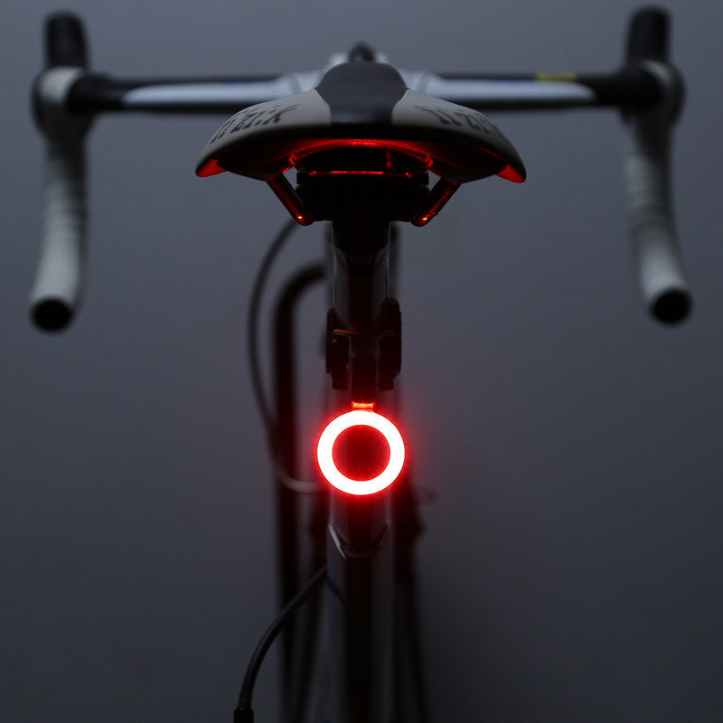 Bicycle tail light on a dark background