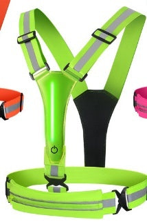 Green reflective safety harness with black straps on a white background
