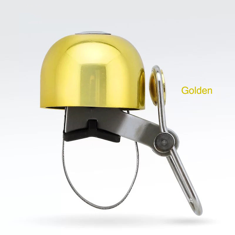 Gold bicycle bell on a white background