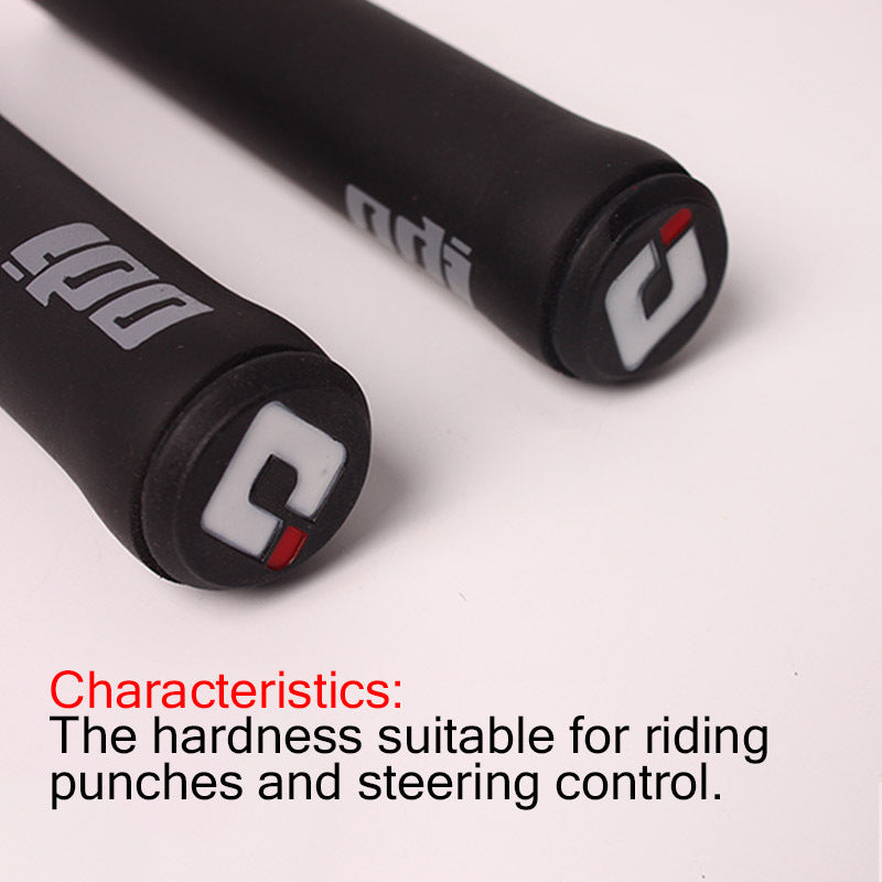Close-up of black Silicone Bicycle Handlebar Grips with visible branding on a white background