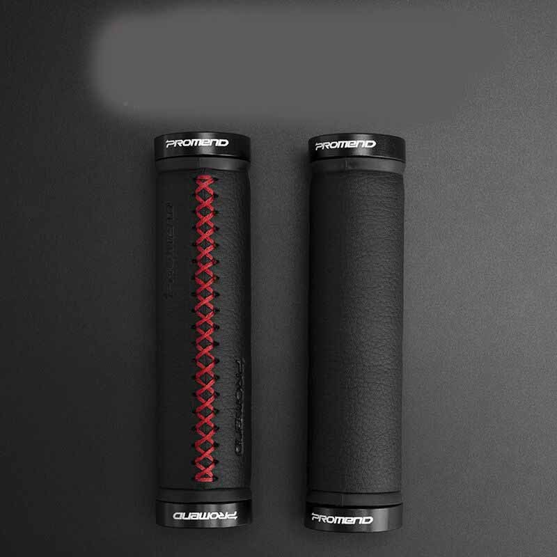 Two black Synthetic Leather Bicycle Handlebar Grips with red stitching on a dark gray background