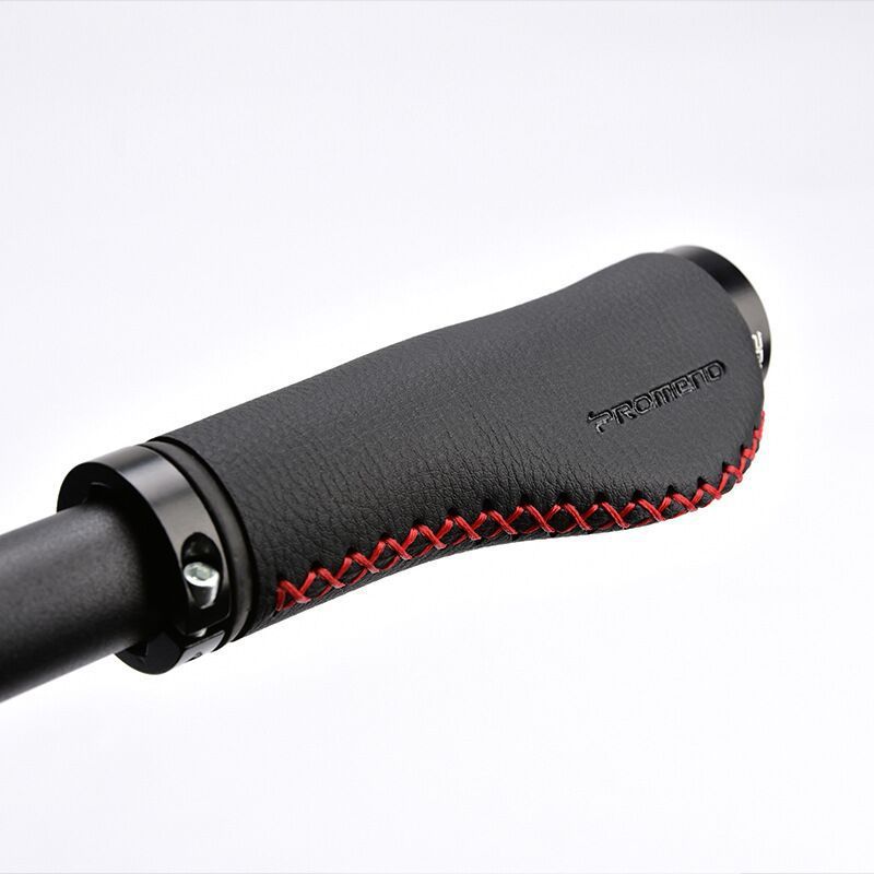 Black Synthetic Leather Bicycle Handlebar Grips with red stitching on a white background