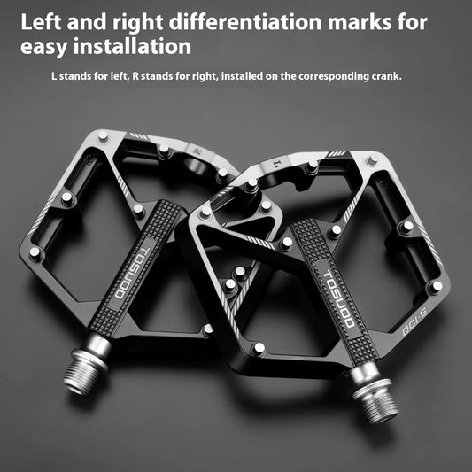 Two CNC aluminium alloy bicycle pedals with 'L' and 'R' markings on a dark background