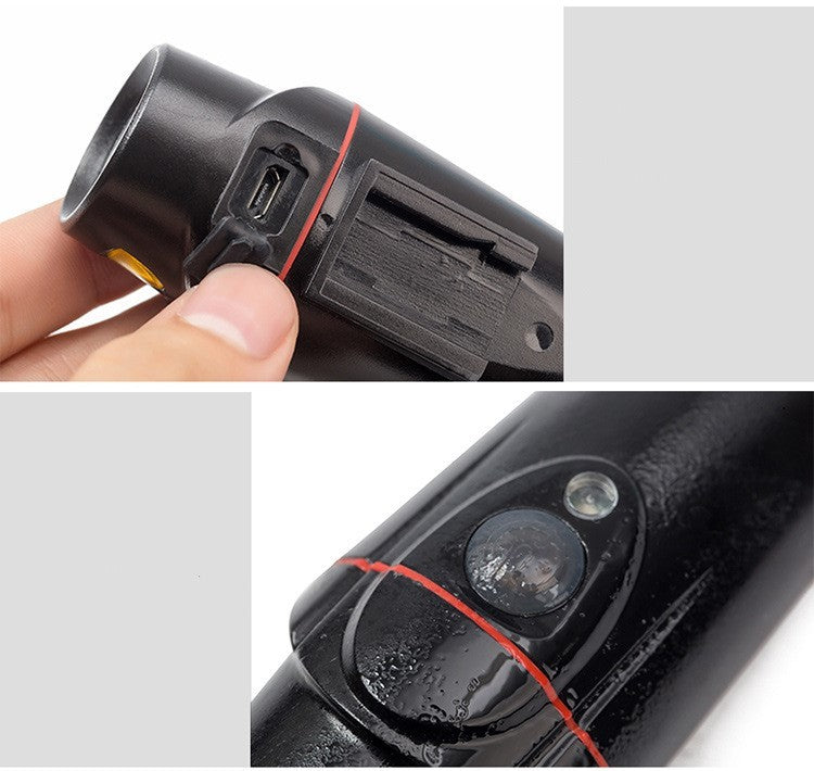 Close-up of a black USB Rechargeable Front Bicycle Light with a USB port and other components, held by a hand.