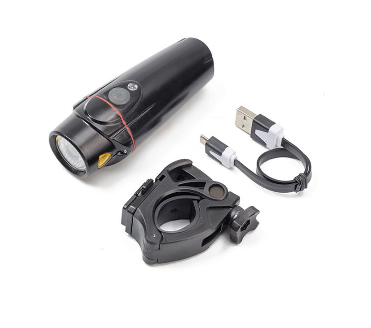 Black bike light with mounting bracket and USB cable on a white background