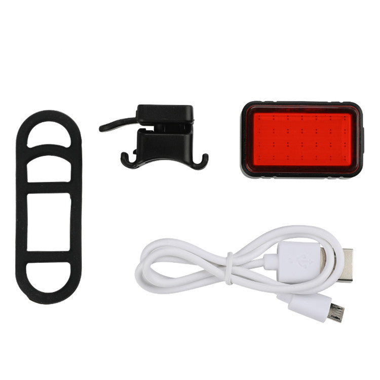 USB Smart Sensor Rear Bicycle Light with red LED light, mounting bracket, USB cable on a white background