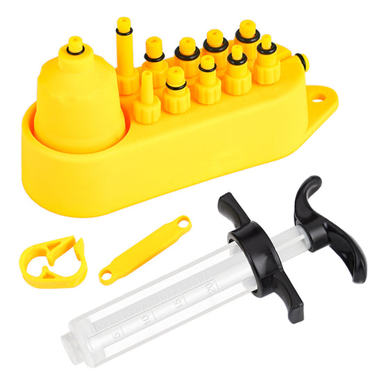 Yellow bicycle disc brake fluid replacement kit with various components on a white background