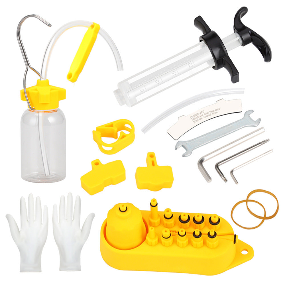 Bicycle disc brake bleeding kit including a syringe, and various components on a white background.
