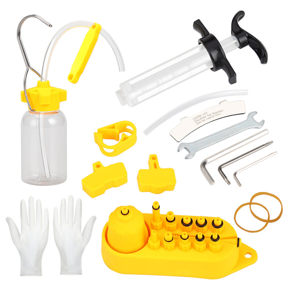 Bicycle disc brake bleeding kit, including a syringes, and various components on a white background.