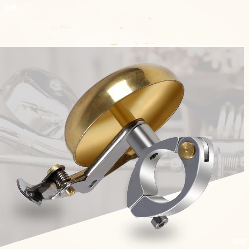 Gold and silver bicycle bell on a white background